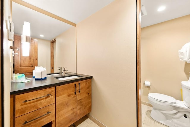 1945 Cornice Rd Unit 304 2334, Steamboat Springs, CO 80487 - bathroom featuring toilet, tile patterned flooring, vanity, and baseboards