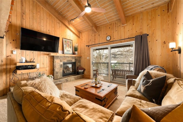 1945 Cornice Rd Unit 304 2334, Steamboat Springs, CO 80487 - living area with wood walls, high vaulted ceiling, a fireplace, carpet floors, and beamed ceiling