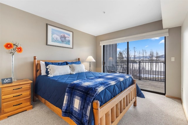 carpeted bedroom with access to exterior and baseboards