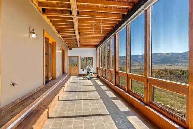 34995 Country Green Rd, Steamboat Springs, CO 80487 - unfurnished sunroom with a mountain view and tile patterned flooring
