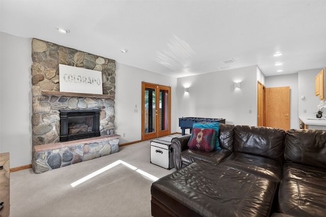 773 Range Rd, Breckenridge, CO 80424 - living area featuring carpet floors, a stone fireplace, and recessed lighting