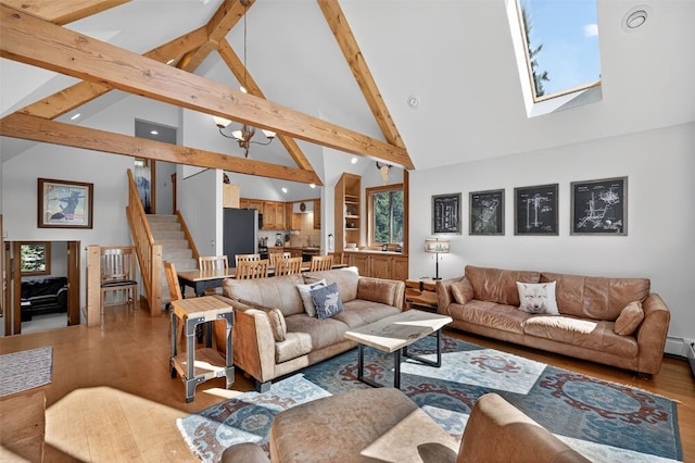 773 Range Rd, Breckenridge, CO 80424 - living room with high vaulted ceiling, beamed ceiling, stairs, wood finished floors, and a skylight