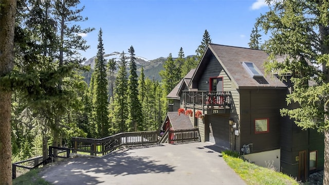 773 Range Rd, Breckenridge, CO 80424 - view of front of property with a balcony, a mountain view, and driveway