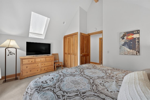 773 Range Rd, Breckenridge, CO 80424 - carpeted bedroom featuring a skylight, high vaulted ceiling, and a closet