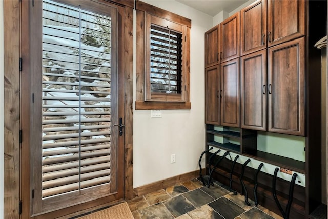 2542 Ski Trail Ln, Steamboat Springs, CO 80487 - doorway to outside with stone finish floor and baseboards