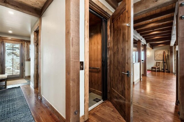 2542 Ski Trail Ln, Steamboat Springs, CO 80487 - hallway with recessed lighting, beam ceiling, wood finished floors, and baseboards