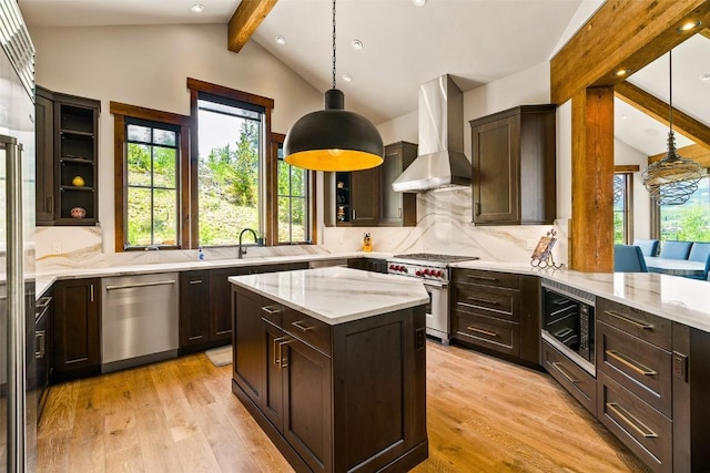 455 Highfield Trl, Breckenridge, CO 80424 - kitchen featuring wall chimney range hood, appliances with stainless steel finishes, healthy amount of natural light, tasteful backsplash, and recessed lighting