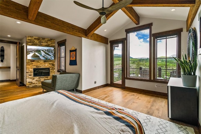 455 Highfield Trl, Breckenridge, CO 80424 - bedroom with access to outside, light wood finished floors, a stone fireplace, recessed lighting, and ceiling fan