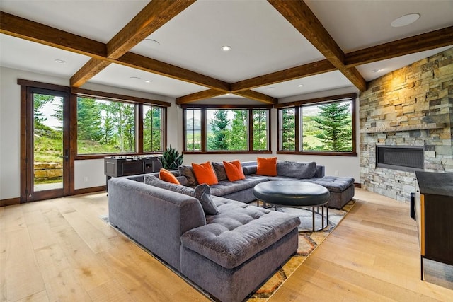 455 Highfield Trl, Breckenridge, CO 80424 - living room featuring beamed ceiling, light wood-style flooring, a fireplace, and coffered ceiling
