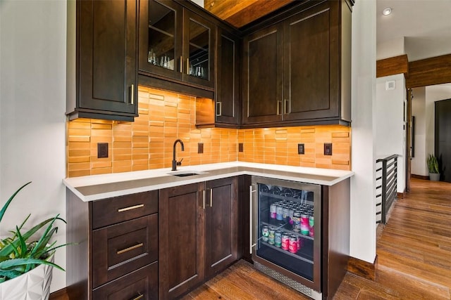 455 Highfield Trl, Breckenridge, CO 80424 - bar area featuring wine cooler, dark wood finished floors, and decorative backsplash