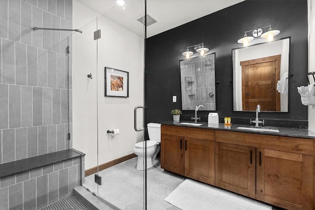 full bathroom featuring visible vents, a sink, tile patterned floors, and a shower stall
