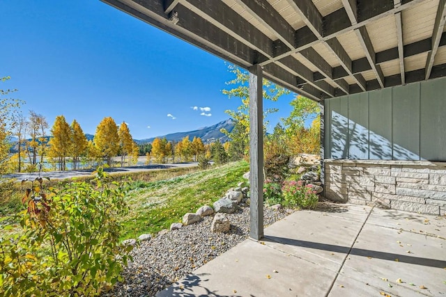 view of patio / terrace featuring a mountain view