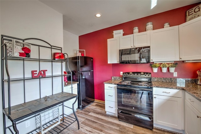 kitchen featuring black appliances, recessed lighting, white cabinetry, and light wood-type flooring