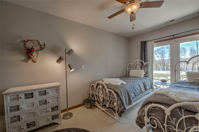 bedroom with baseboards, visible vents, carpet, access to outside, and ceiling fan
