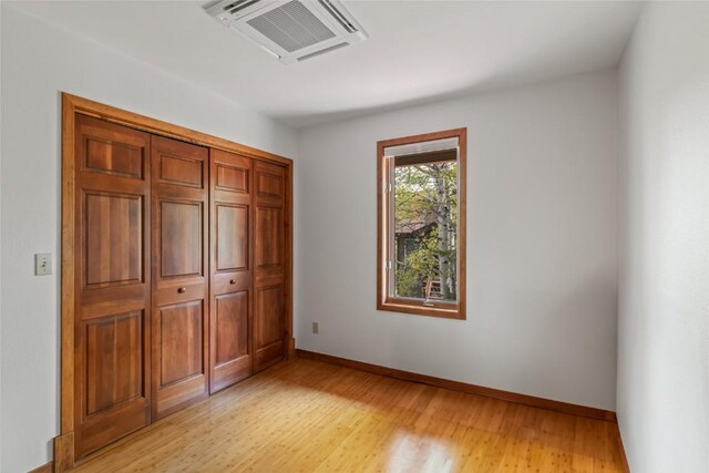 663 Amethyst Dr, Steamboat Springs, CO 80487 - unfurnished bedroom featuring light wood-type flooring, baseboards, and a closet