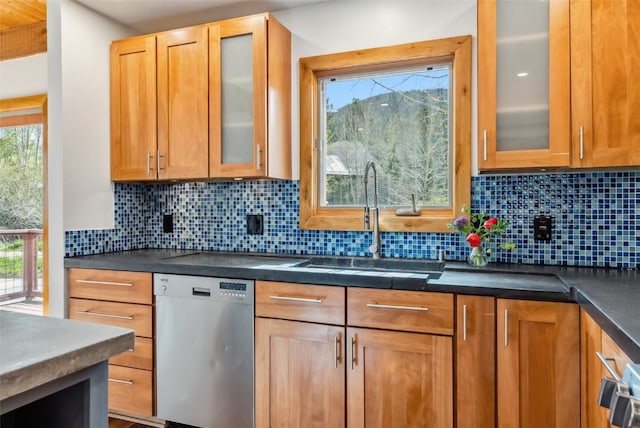 475 Vail Cir, Dillon, CO 80435 - kitchen featuring stainless steel dishwasher, a sink, dark countertops, and decorative backsplash