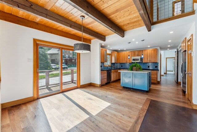 475 Vail Cir, Dillon, CO 80435 - kitchen with baseboards, stainless steel appliances, decorative backsplash, wooden ceiling with exposed beams, and a center island