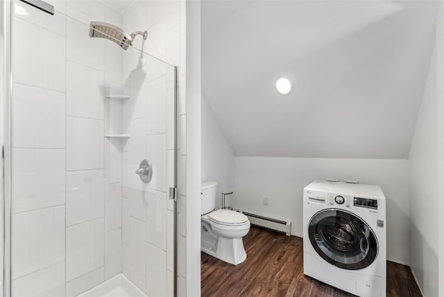 475 Vail Cir, Dillon, CO 80435 - bathroom featuring washer / clothes dryer, a baseboard heating unit, a shower stall, lofted ceiling, and toilet