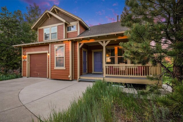 104 Saddle Horn Ct, Granby, CO 80446 - craftsman-style home featuring an attached garage, driveway, and covered porch