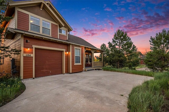 104 Saddle Horn Ct, Granby, CO 80446 - view of front facade with concrete driveway and an attached garage
