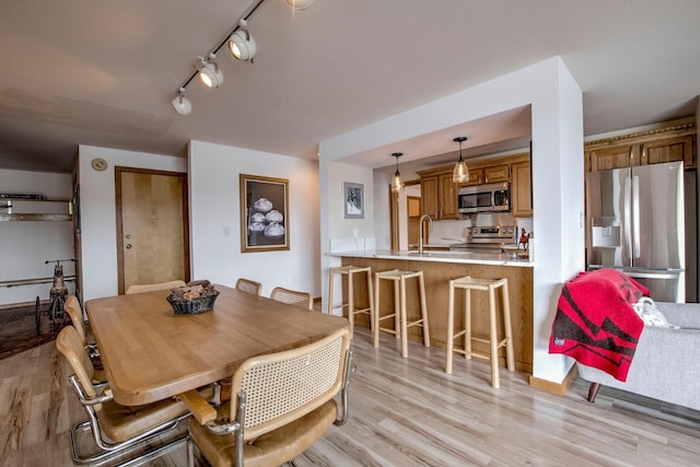 188 E Ln Bonte St Unit 327, Dillon, CO 80435 - dining space with light wood finished floors and rail lighting