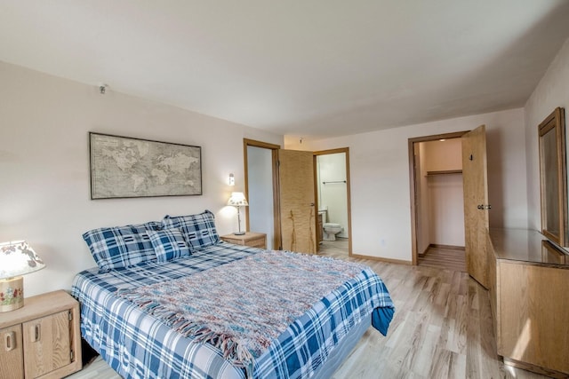 188 E Ln Bonte St Unit 327, Dillon, CO 80435 - bedroom featuring light wood finished floors, a spacious closet, a closet, and connected bathroom