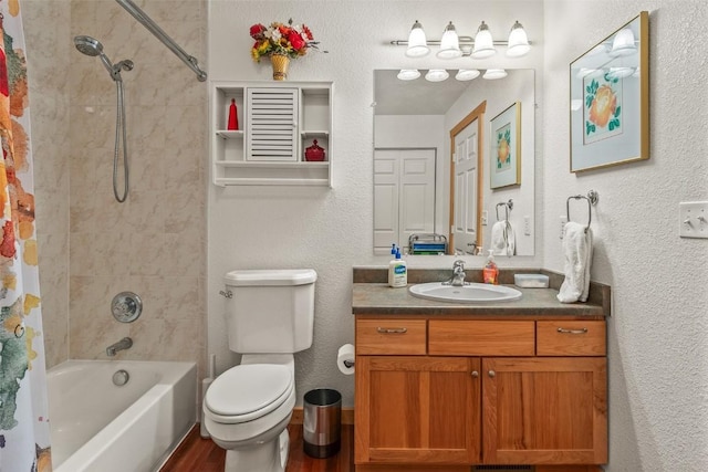 full bath featuring a textured wall, shower / bath combo, vanity, toilet, and wood finished floors