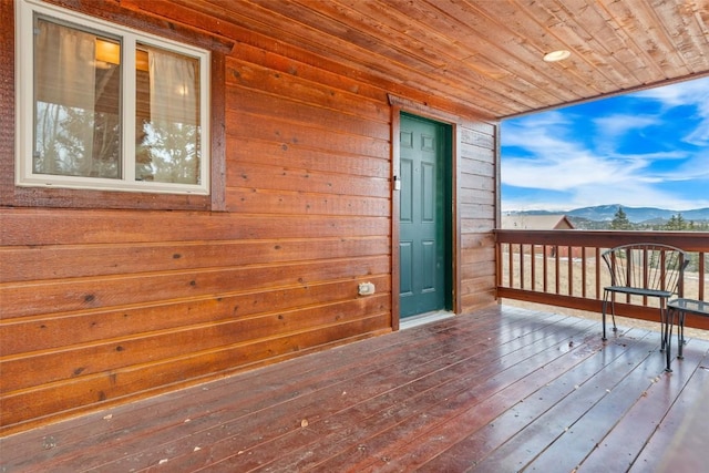 wooden terrace featuring a mountain view
