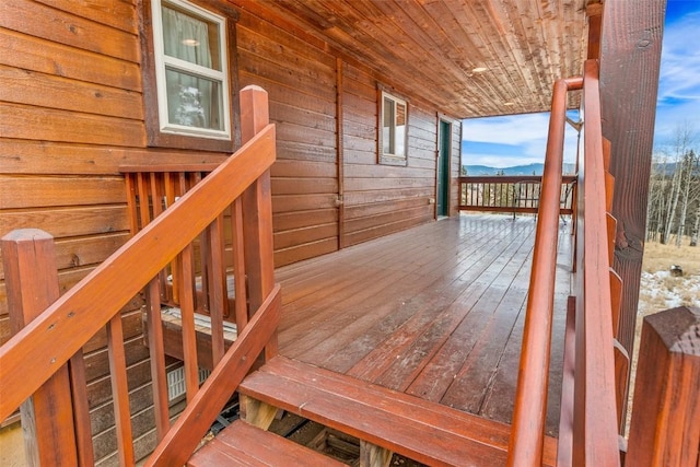 wooden terrace with a mountain view