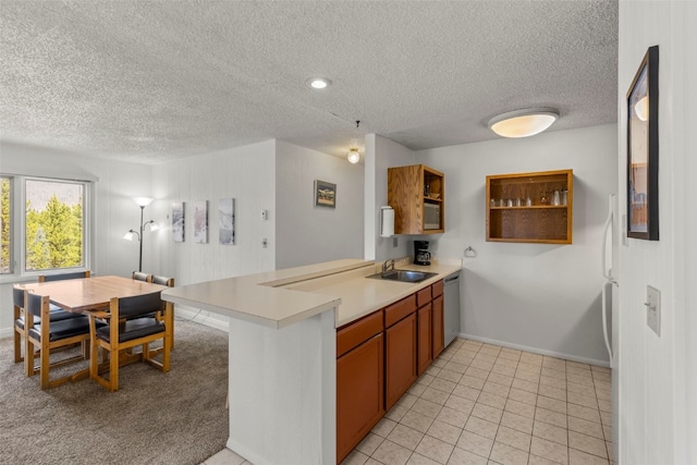 1513 E Keystone Rd Unit 2967, Keystone, CO 80435 - kitchen with stainless steel dishwasher, a peninsula, a textured ceiling, and light countertops