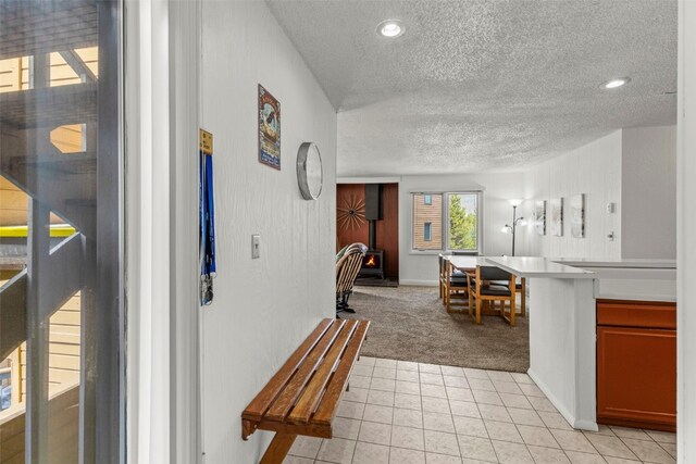 1513 E Keystone Rd Unit 2967, Keystone, CO 80435 - interior space with baseboards, a textured ceiling, light colored carpet, and light tile patterned floors