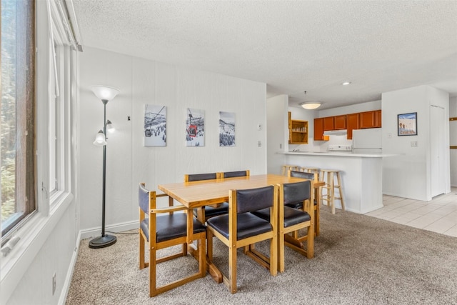 1513 E Keystone Rd Unit 2967, Keystone, CO 80435 - dining area featuring light carpet, a textured ceiling, and light tile patterned floors