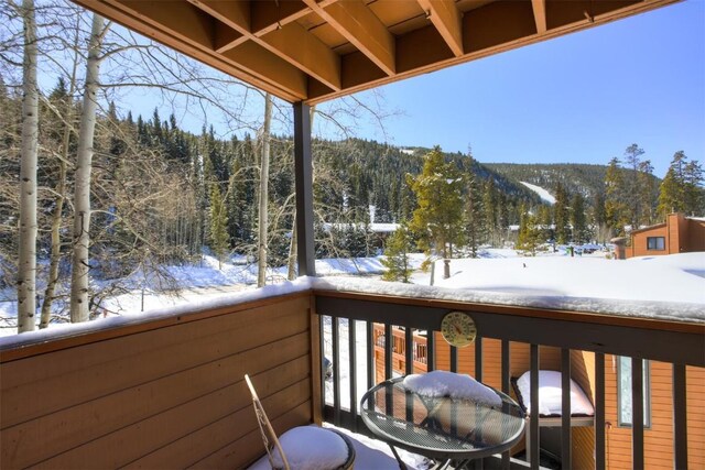 1513 E Keystone Rd Unit 2967, Keystone, CO 80435 - snow covered back of property featuring a forest view and a mountain view