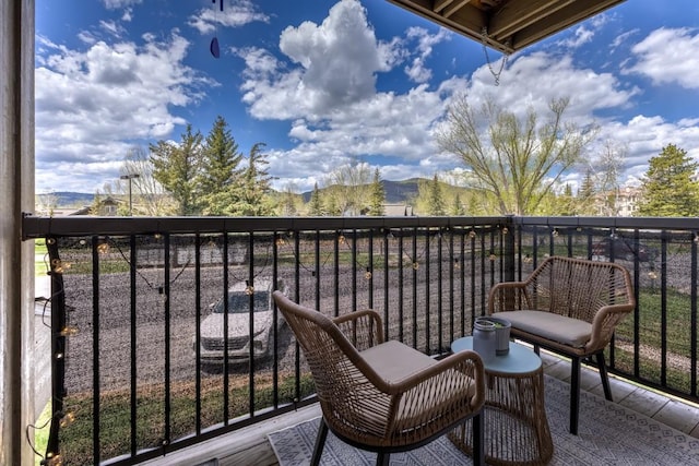 balcony featuring a mountain view