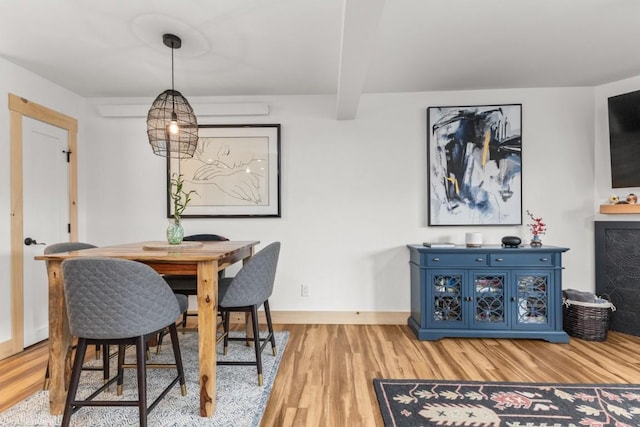 dining room with wood finished floors and baseboards