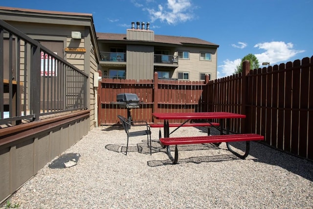 view of patio featuring fence