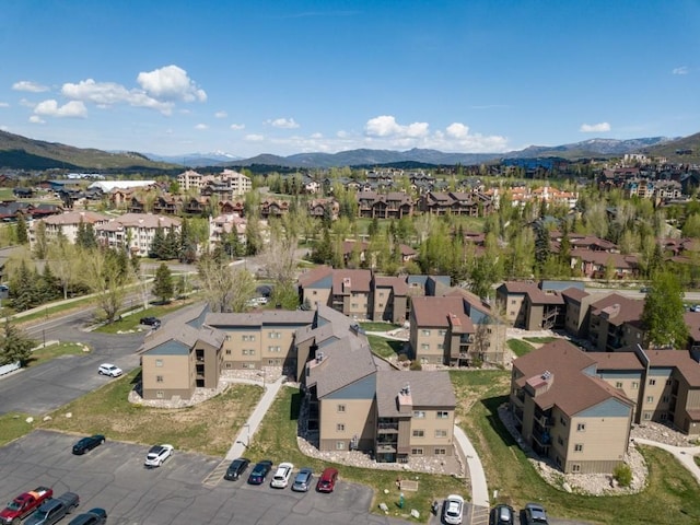 view of property location with a mountainous background and nearby suburban area