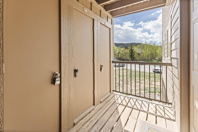 doorway to outside with light wood-style flooring