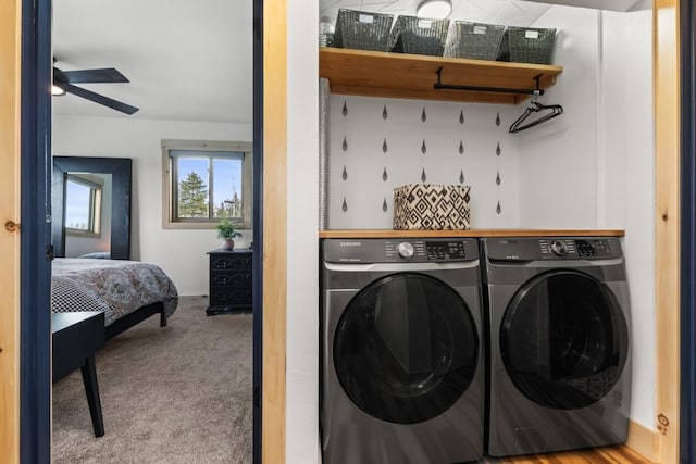 laundry room featuring washing machine and dryer, carpet flooring, and ceiling fan