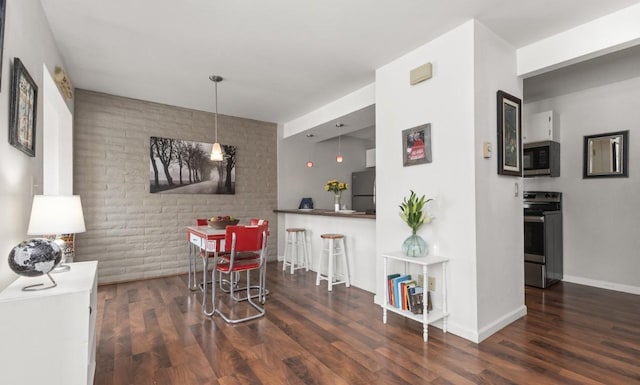 3 Cedar Ct Unit 3, Steamboat Springs, CO 80487 - dining area with wood finished floors and baseboards