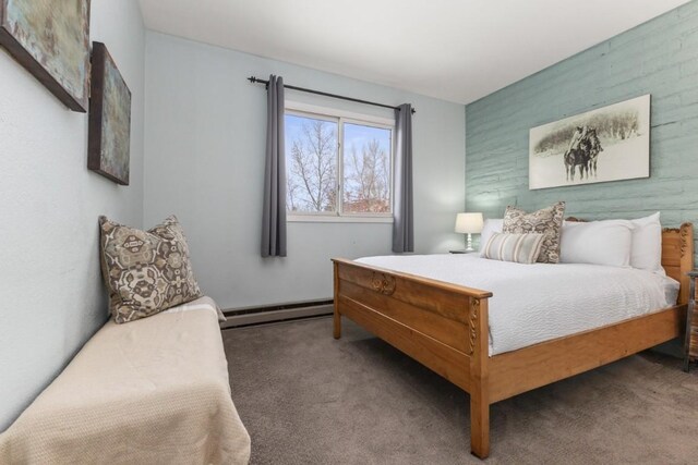 3 Cedar Ct Unit 3, Steamboat Springs, CO 80487 - bedroom with a baseboard heating unit and carpet flooring