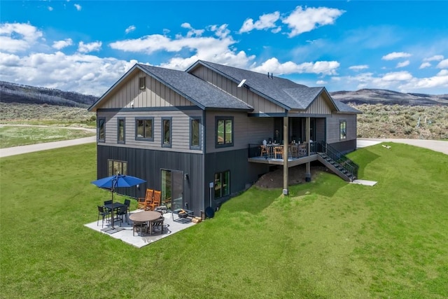 23430 Postrider Trl, Oak Creek, CO 80467 - back of property with a yard, roof with shingles, a patio area, and board and batten siding