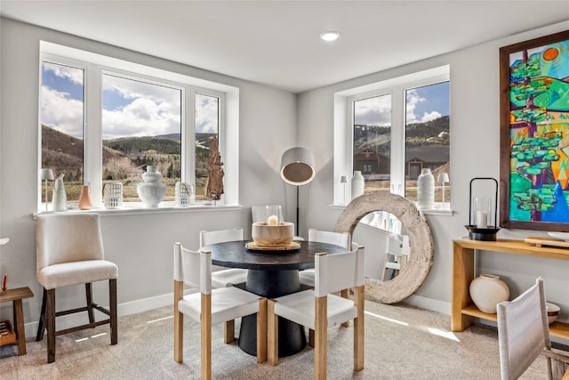 23430 Postrider Trl, Oak Creek, CO 80467 - carpeted dining room with healthy amount of natural light, baseboards, a mountain view, and recessed lighting