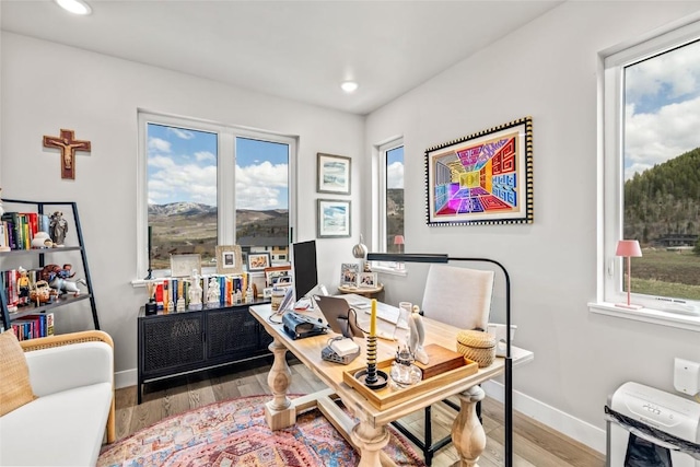23430 Postrider Trl, Oak Creek, CO 80467 - home office with plenty of natural light, wood finished floors, baseboards, and recessed lighting