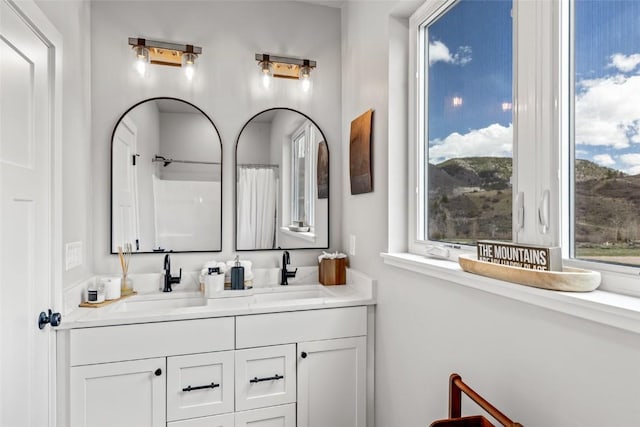 23430 Postrider Trl, Oak Creek, CO 80467 - full bath with double vanity and a shower with shower curtain