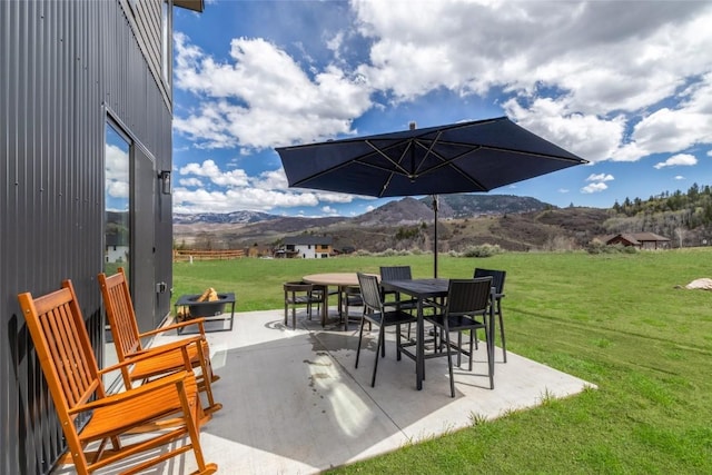 23430 Postrider Trl, Oak Creek, CO 80467 - view of patio / terrace with a mountain view and outdoor dining space