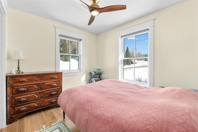 25640 6th Ave, Hahns Peak, CO 80428 - bedroom with ceiling fan and wood finished floors