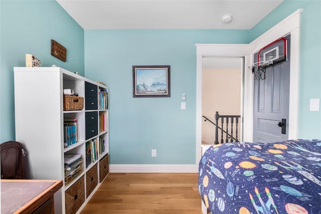 25640 6th Ave, Hahns Peak, CO 80428 - bedroom featuring wood finished floors, a ceiling fan, and baseboards