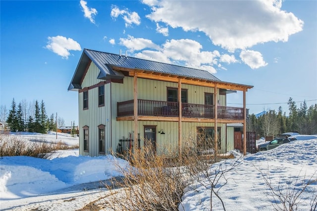 25640 6th Ave, Hahns Peak, CO 80428 - snow covered back of property with board and batten siding and metal roof