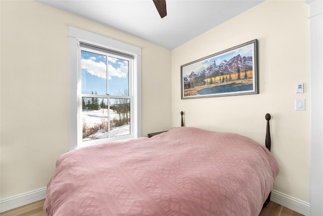 25640 6th Ave, Hahns Peak, CO 80428 - bedroom featuring light wood-type flooring, ceiling fan, and multiple windows